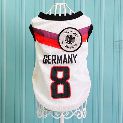 Germany soccer dog jersey with number 8 and German crest on a hanger, blue background