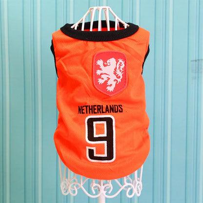 Orange Netherlands soccer dog jersey with lion crest and number 9 on mannequin