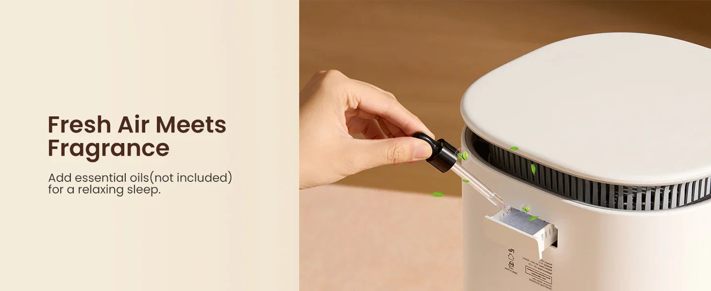 Hand adding essential oil to a white air purifier for fresh, fragrant indoor air